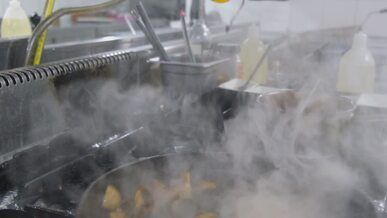 sizzling mushrooms cooking on a stove