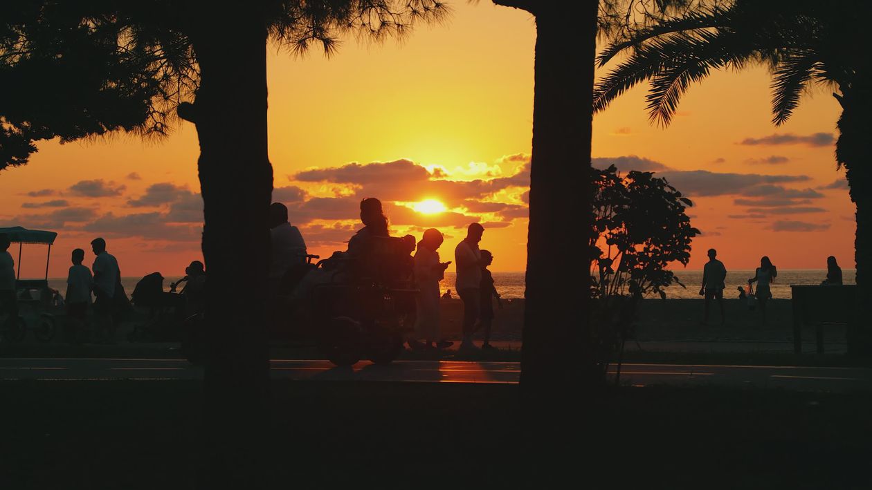 Silhouettes at Sunset on a Scenic Beach Walkway Free Stock Video ...