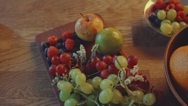 fresh assorted fruits on wooden tray