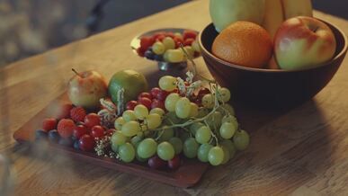 vibrant fruit still life on rustic table