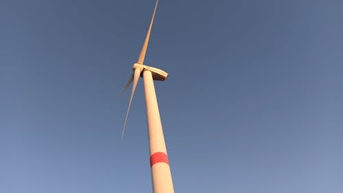 A Windmill In Operation For Renewable Energy Production