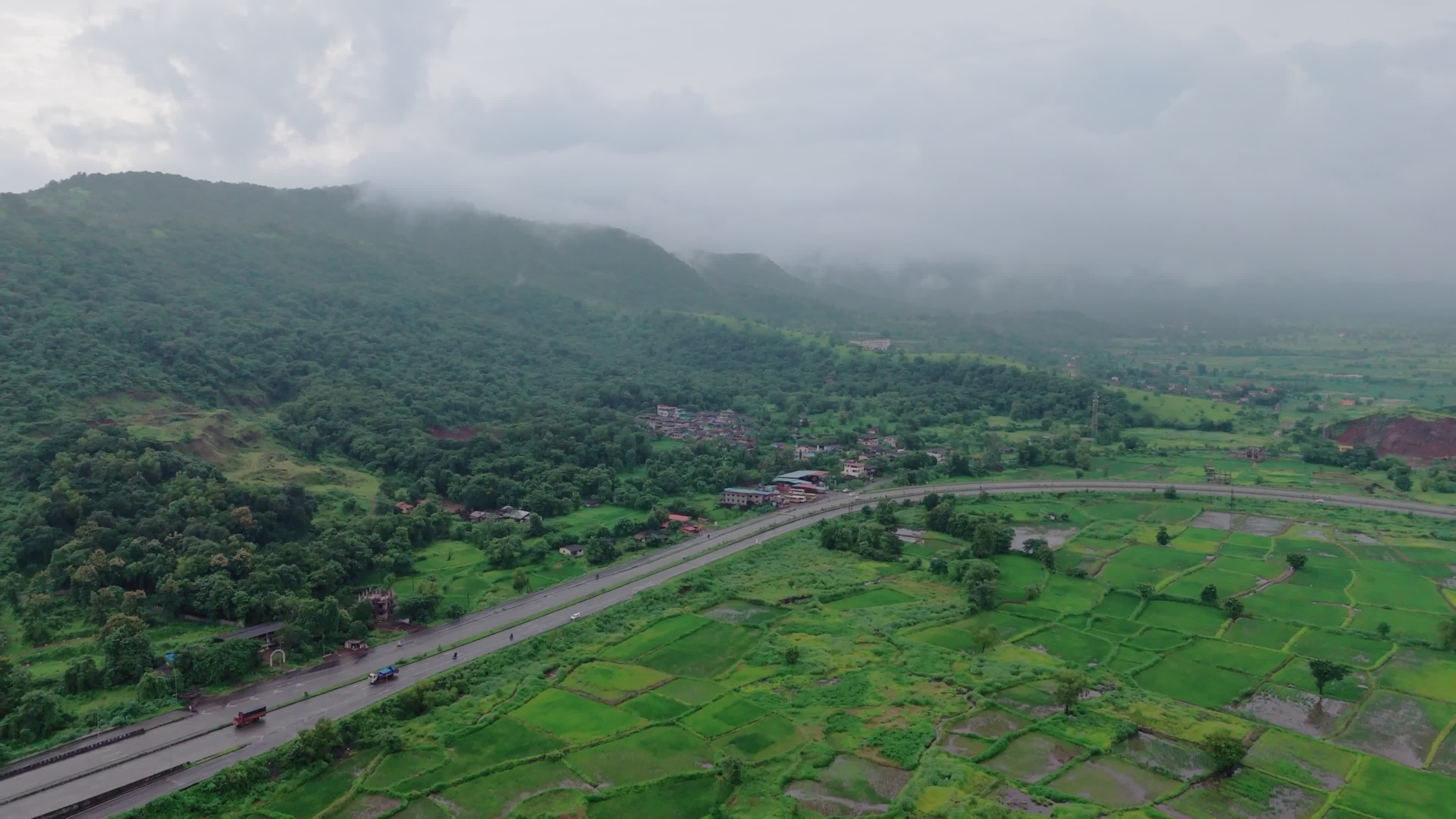Aerial View of Foggy Green Landscape with Road Free Stock Video Footage ...