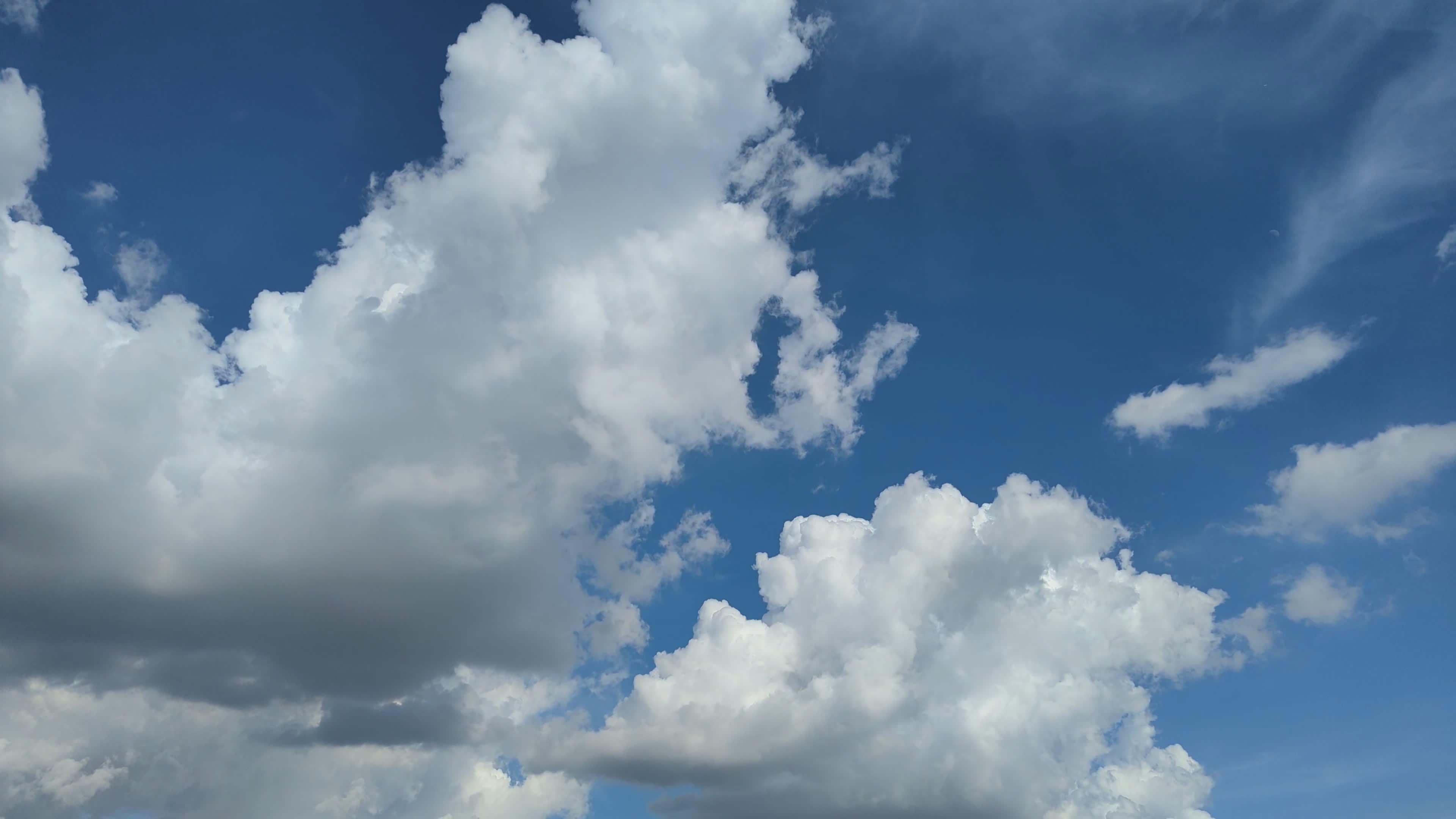 Dynamic Timelapse of Fluffy White Clouds in Blue Sky Free Stock Video ...