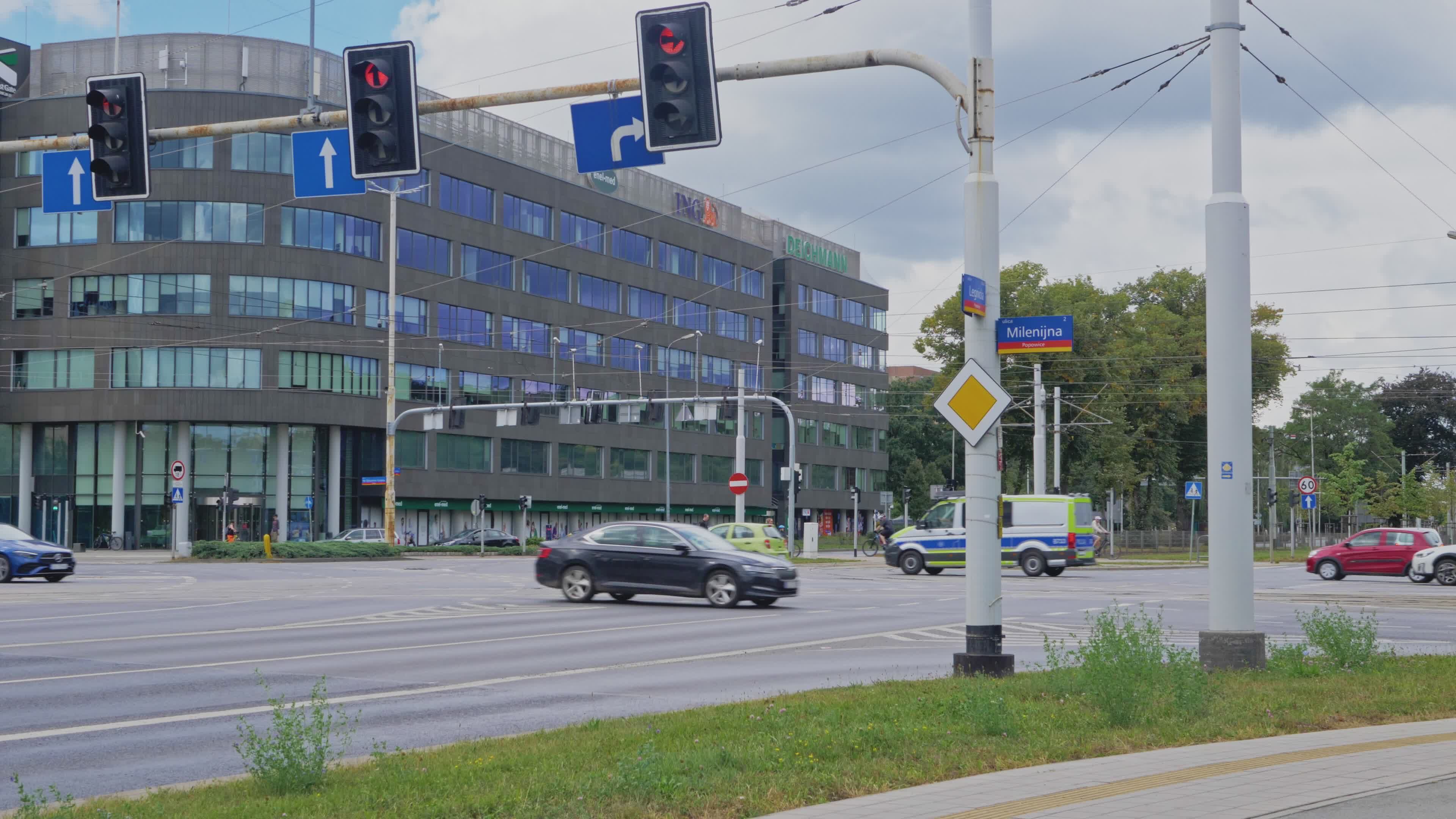 Urban Intersection with Traffic and Modern Building Free Stock Video ...