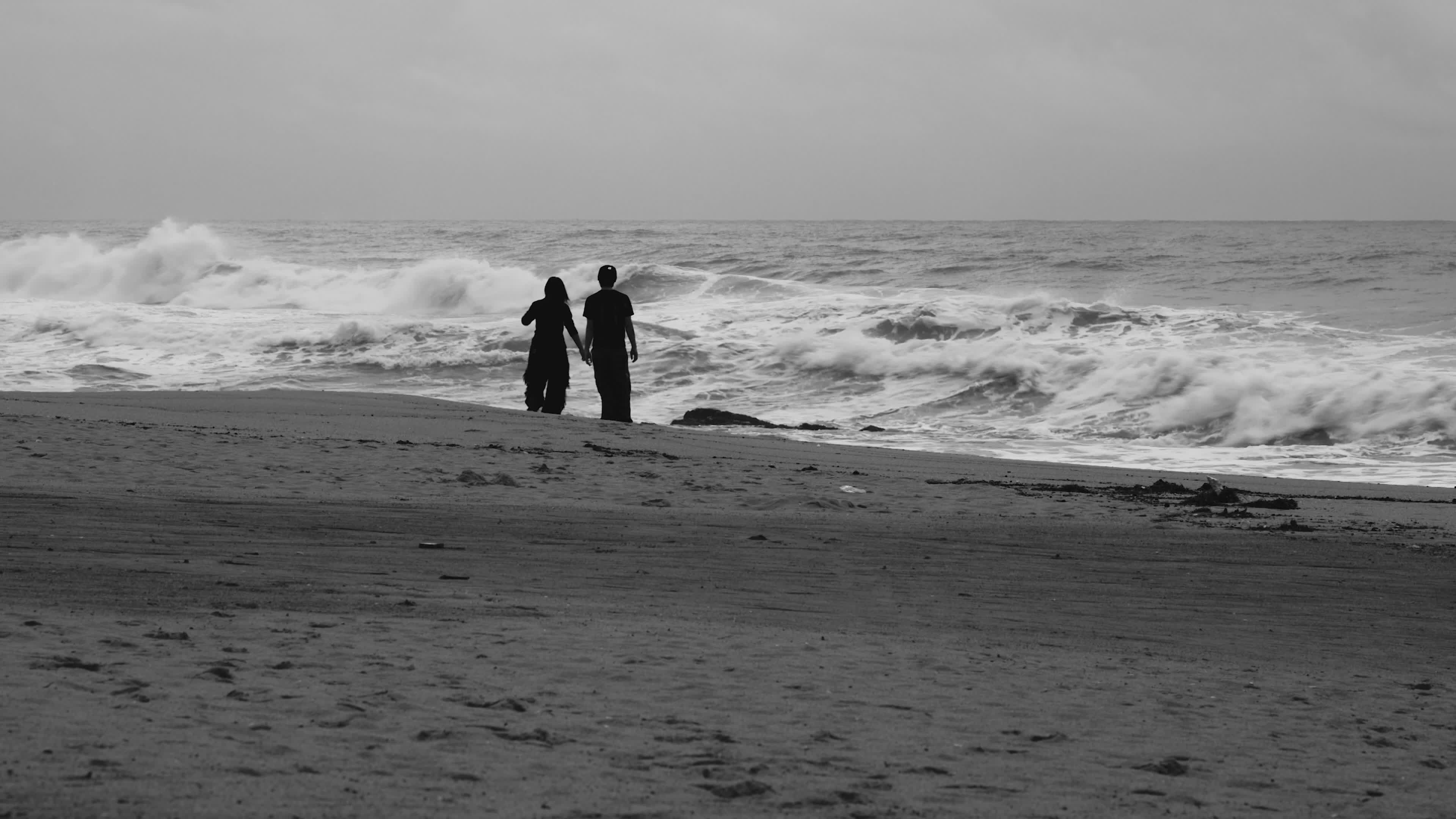 Silhouette of Couple Walking on Beach at Dusk Free Stock Video Footage ...