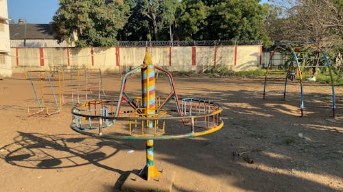 A Steel Merry Go Round Ride In A Playground