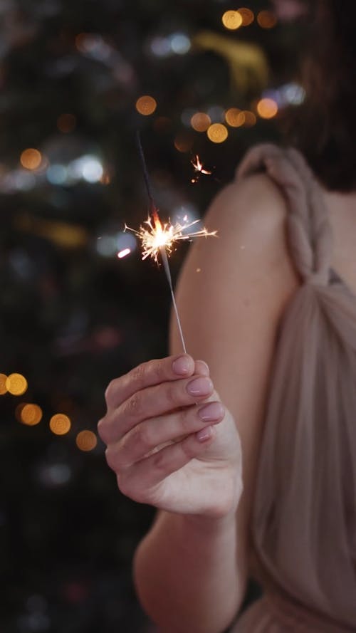 Woman Holding A Lights Sparkle In A Party