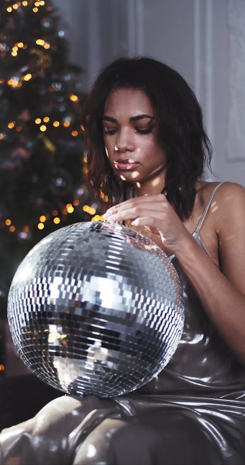 Woman Holding A Disco Ball 