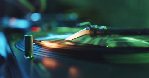 Close-up View Of A Dj's Turntable And Audio Mixer