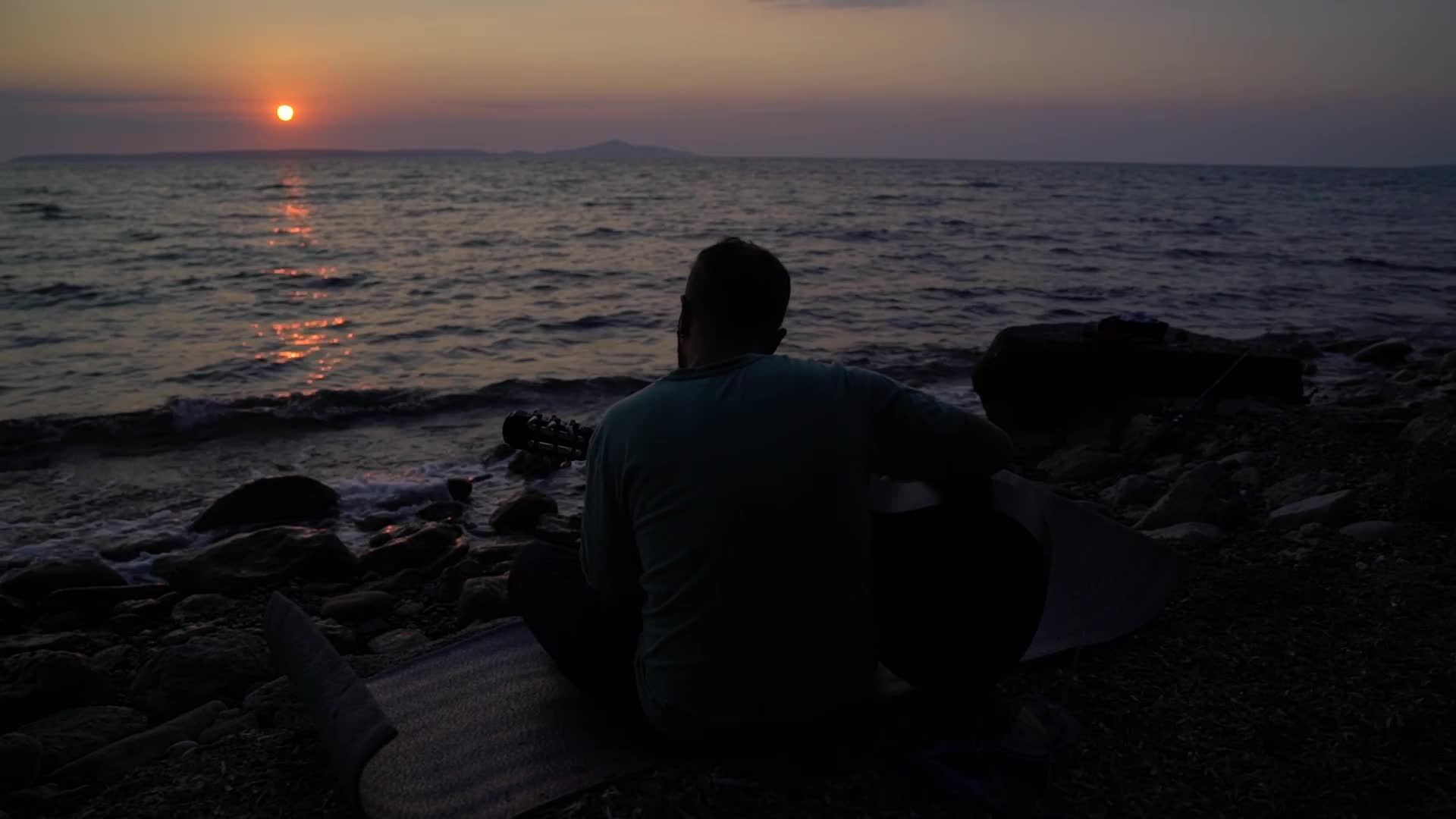 Silhouette of Man Watching Sunset Over Ocean Free Stock Video Footage ...