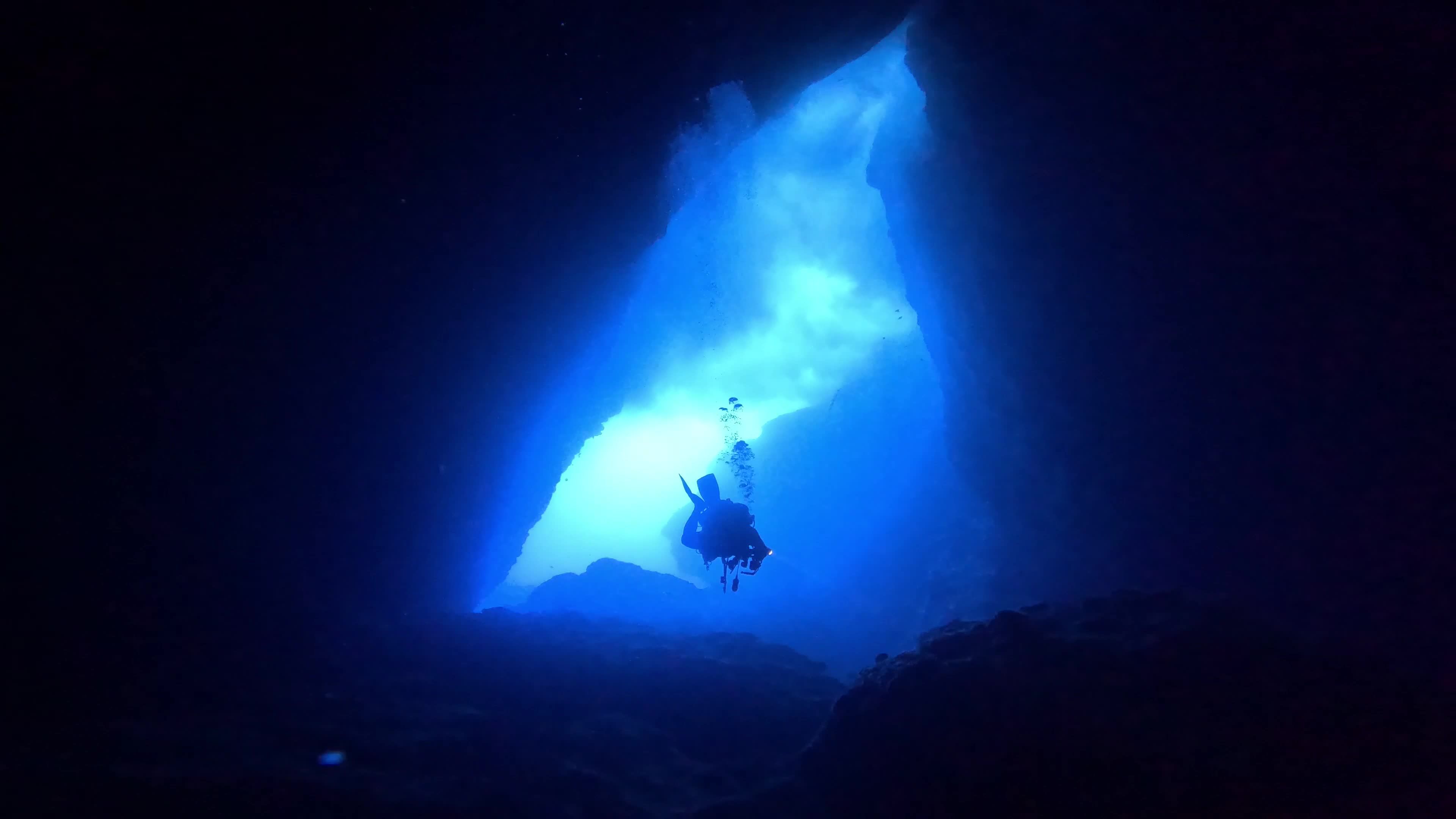 Diver Exploring Underwater Cave in Deep Blue Ocean Free Stock Video ...