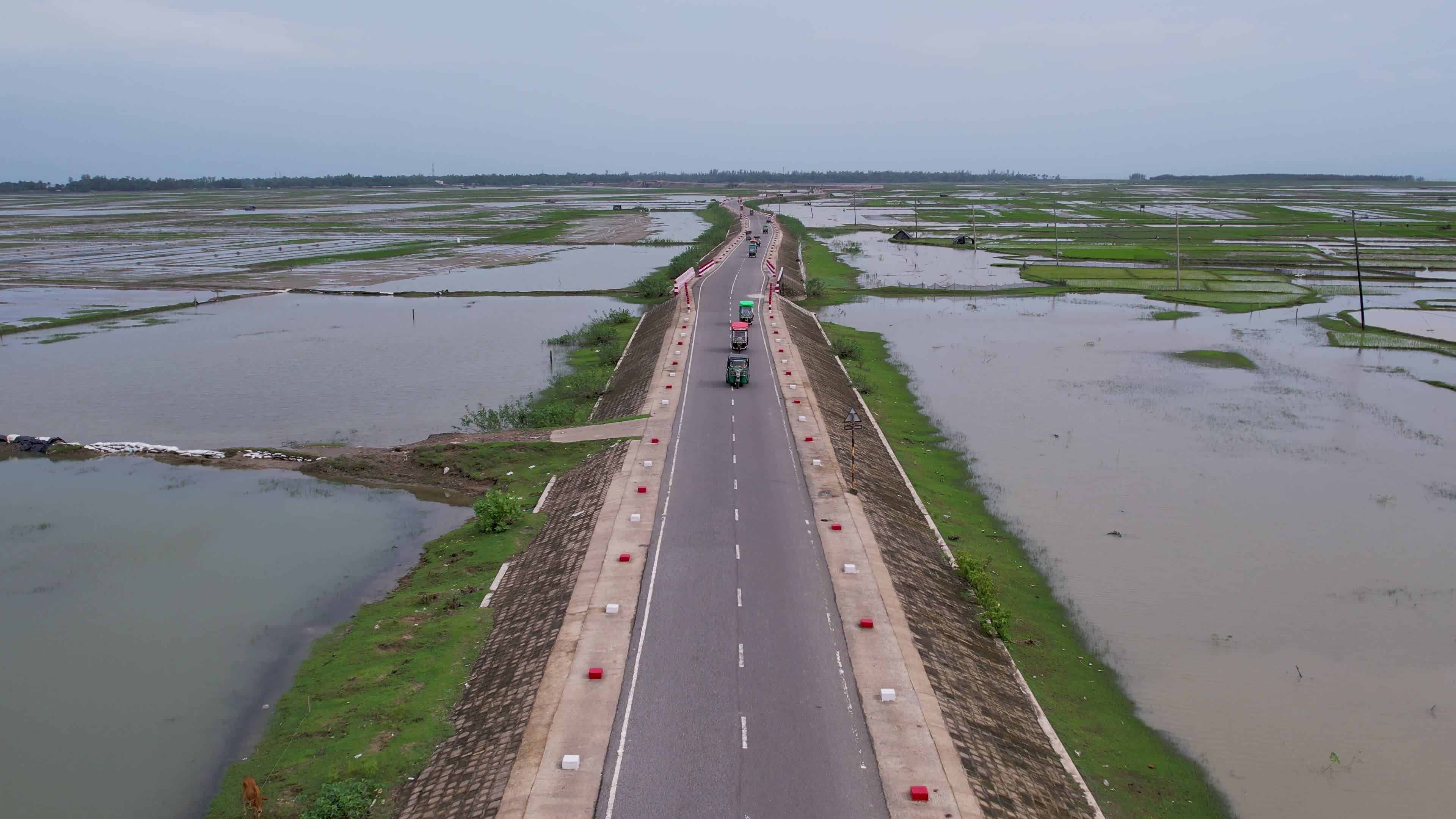 Aerial View of Rural Road Through Flooded Fields Free Stock Video ...