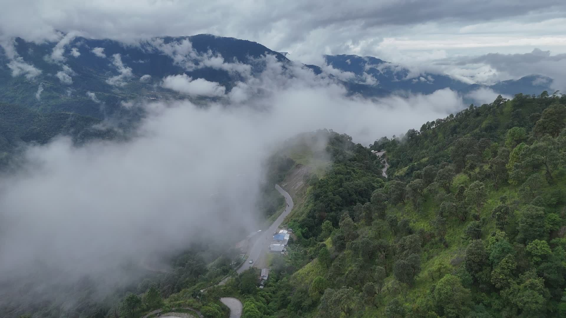 Captivating Aerial View of Misty Mountain Road Free Stock Video Footage ...