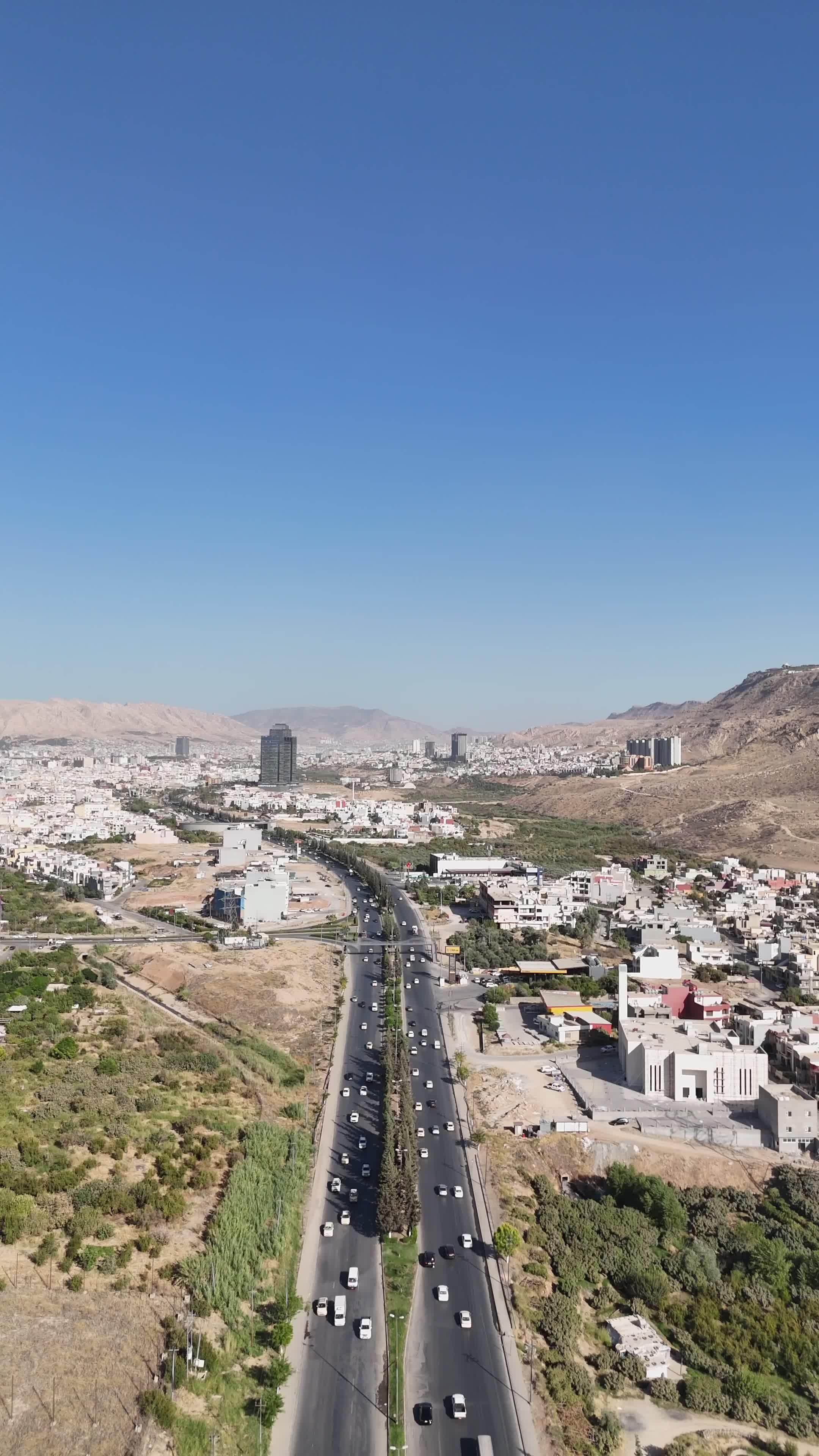 Aerial View of Mountain Road and Urban Landscape Free Stock Video ...