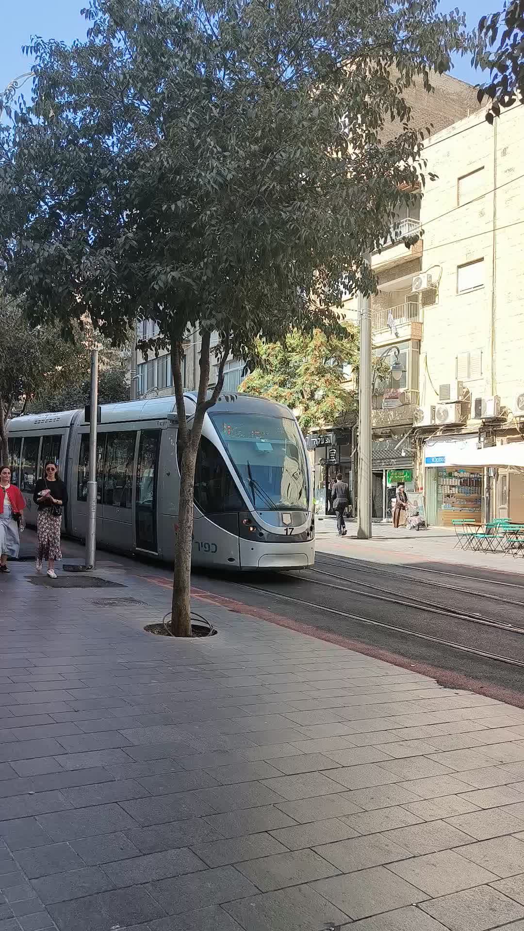 Modern Tram Moving Through Busy Urban Street Free Stock Video Footage ...