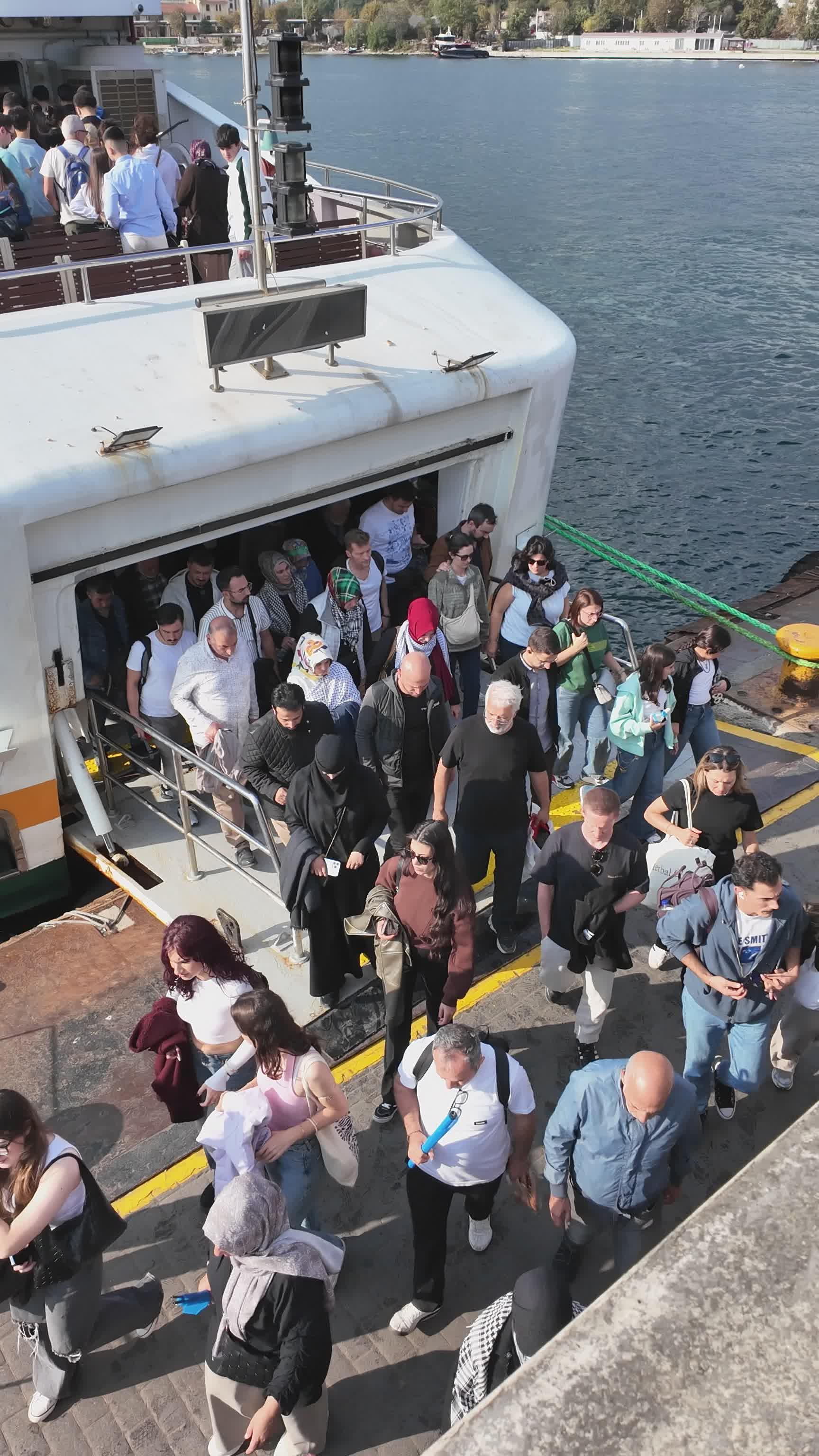 crowd-disembarking-passenger-ferry-at-dock-free-stock-video-footage