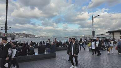 bustling istanbul waterfront on a cloudy day