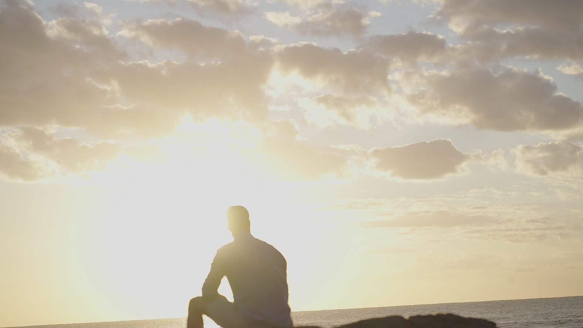 Silhouette of Man Viewing Vibrant Sunset on Beach Free Stock Video ...