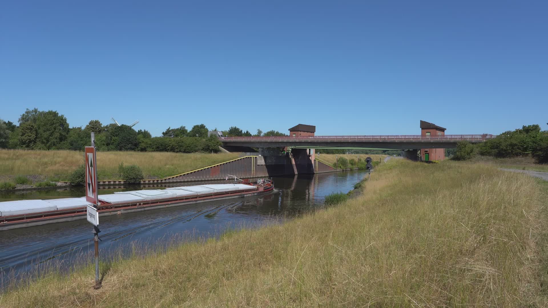 Serene Canal Scene with Passing Merchant Vessel Free Stock Video ...