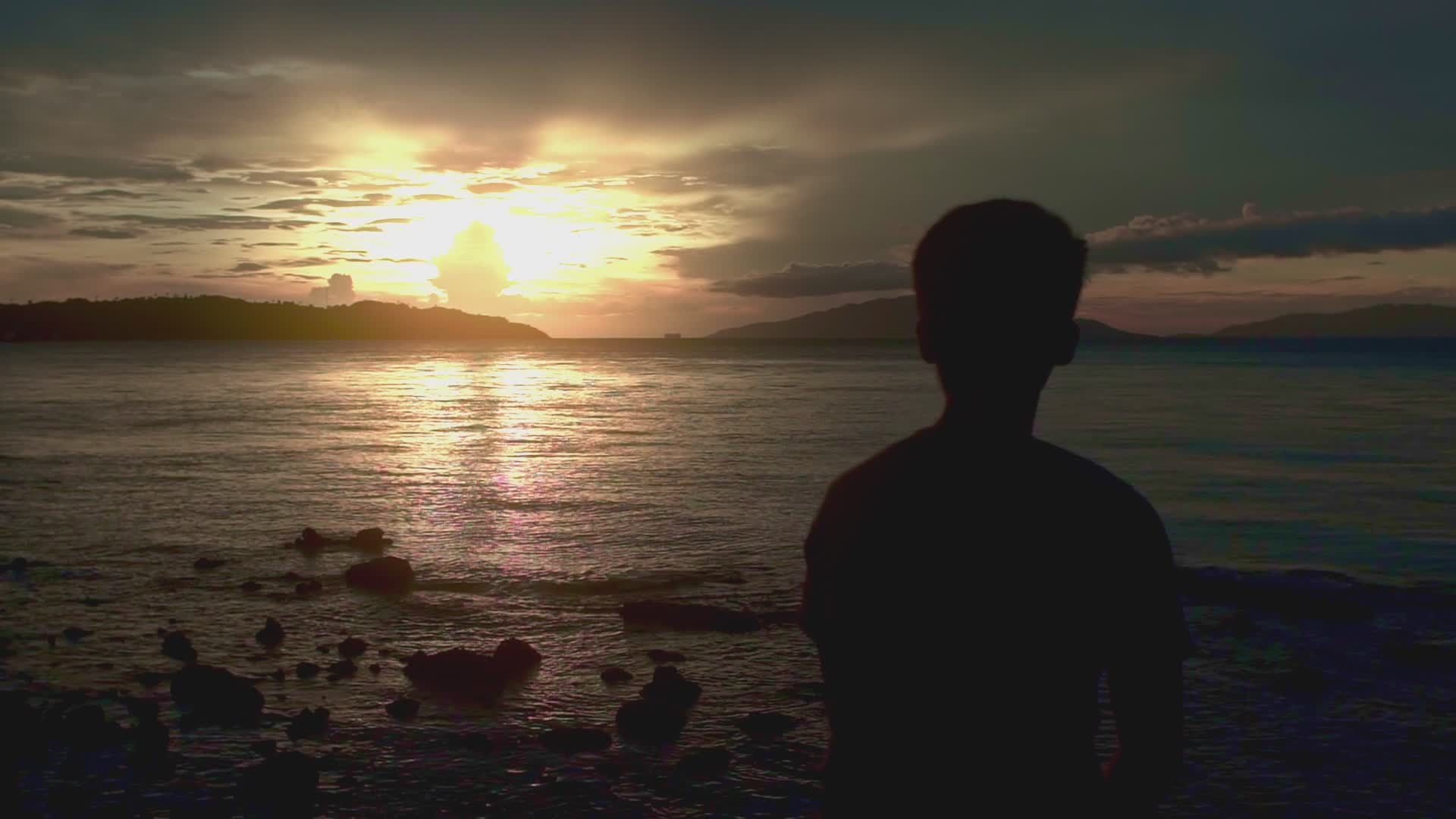Silhouette of Man Watching Sunset Over Ocean Free Stock Video Footage ...