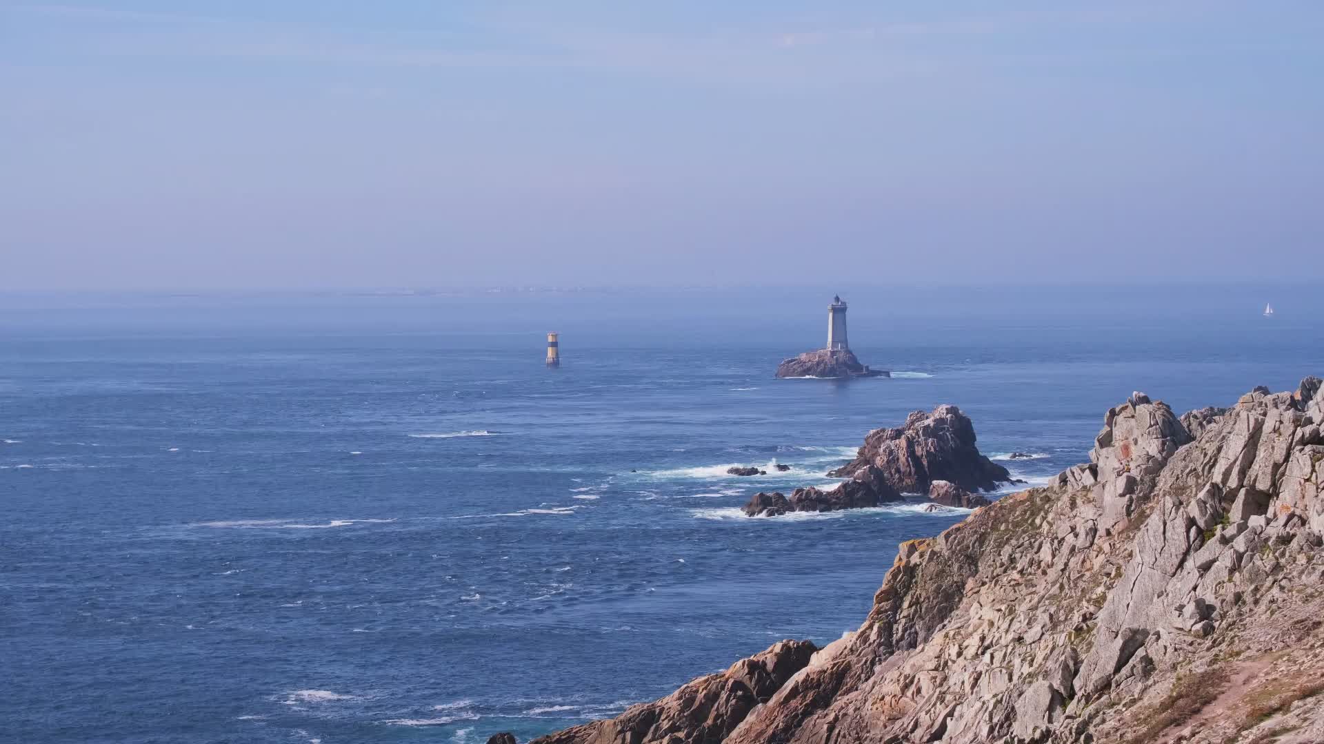 Scenic Coastal View with Lighthouse and Rocks Free Stock Video Footage ...