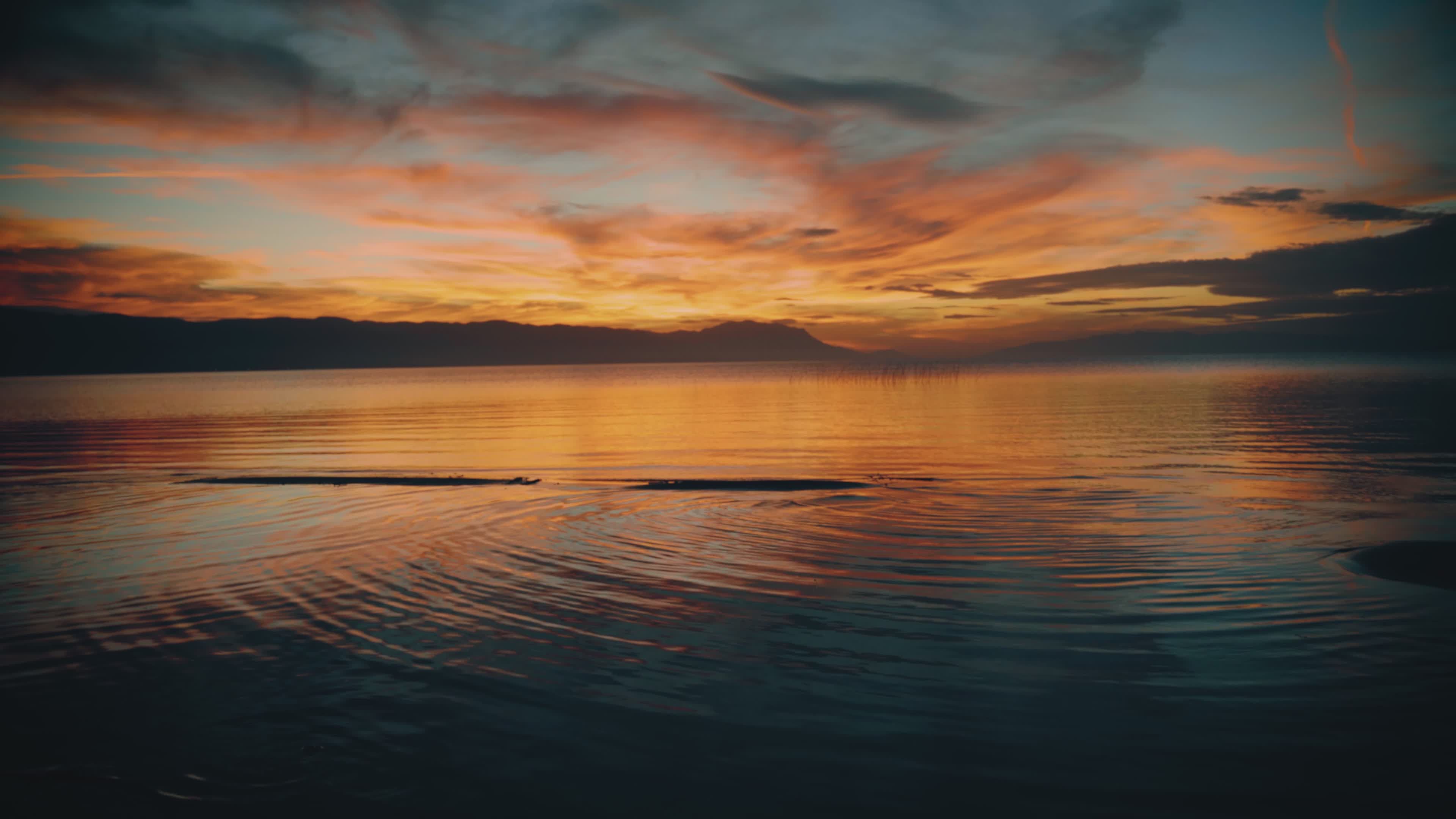 Serene Sunset Over a Calm Reflective Lake Free Stock Video Footage ...
