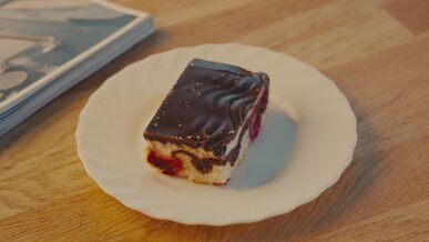 donauwelle cake slice on white plate