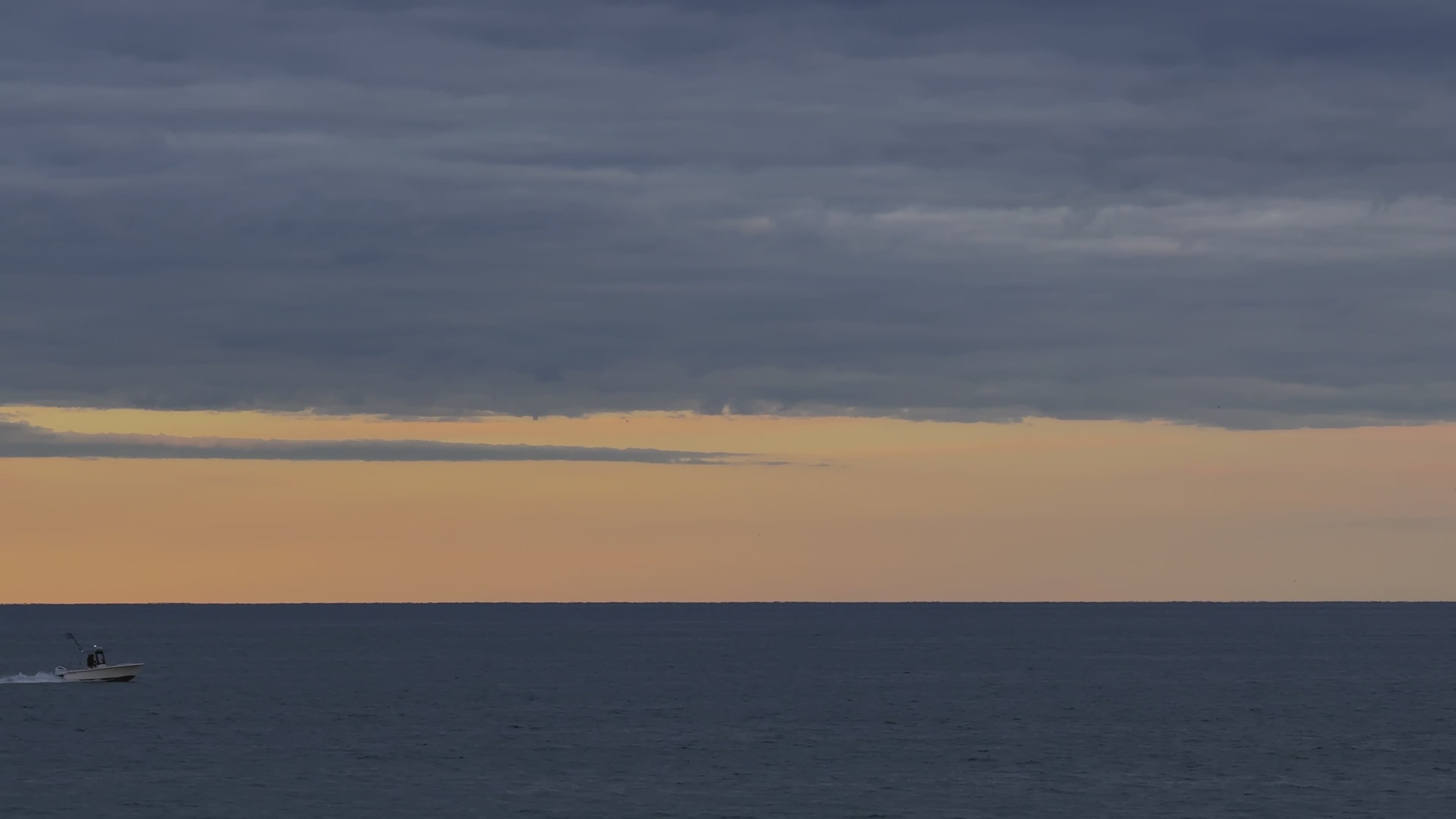 jet ski at sunset on the ocean horizon 34490210