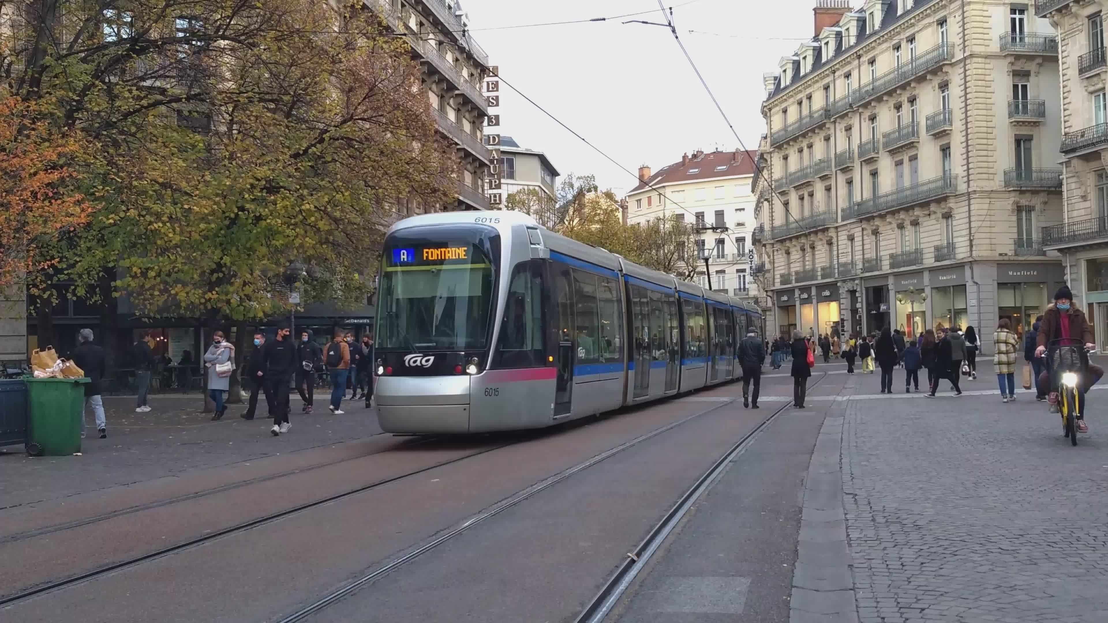 Tram Moving Through Bustling French City Street Free Stock Video ...
