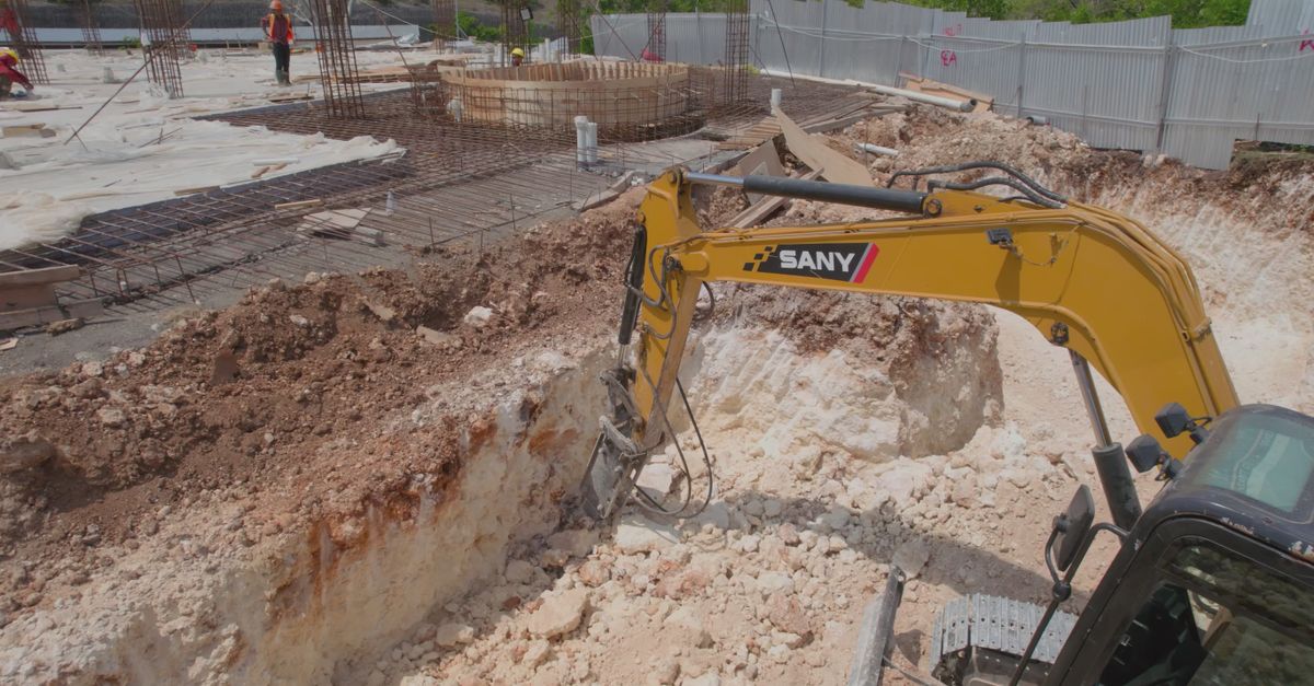 Digging By Compress Excavator Digging at Busy Construction Site Free Stock Video Footage ...