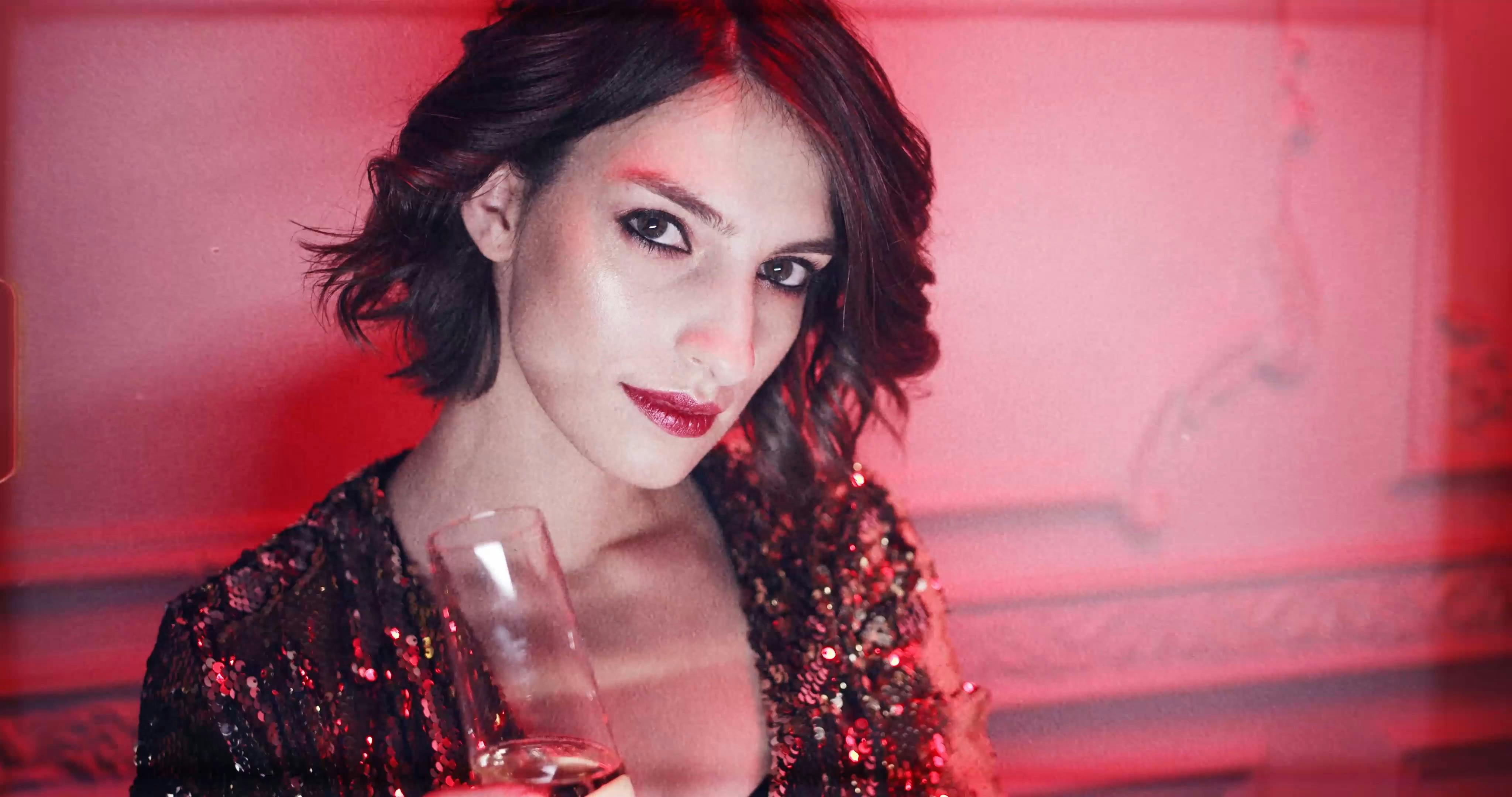 Boomerang Shot Of A Woman With A Glass Of Drink On Hand In A Party Free