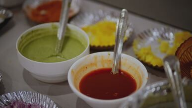 colorful array of indian chutneys in bowls