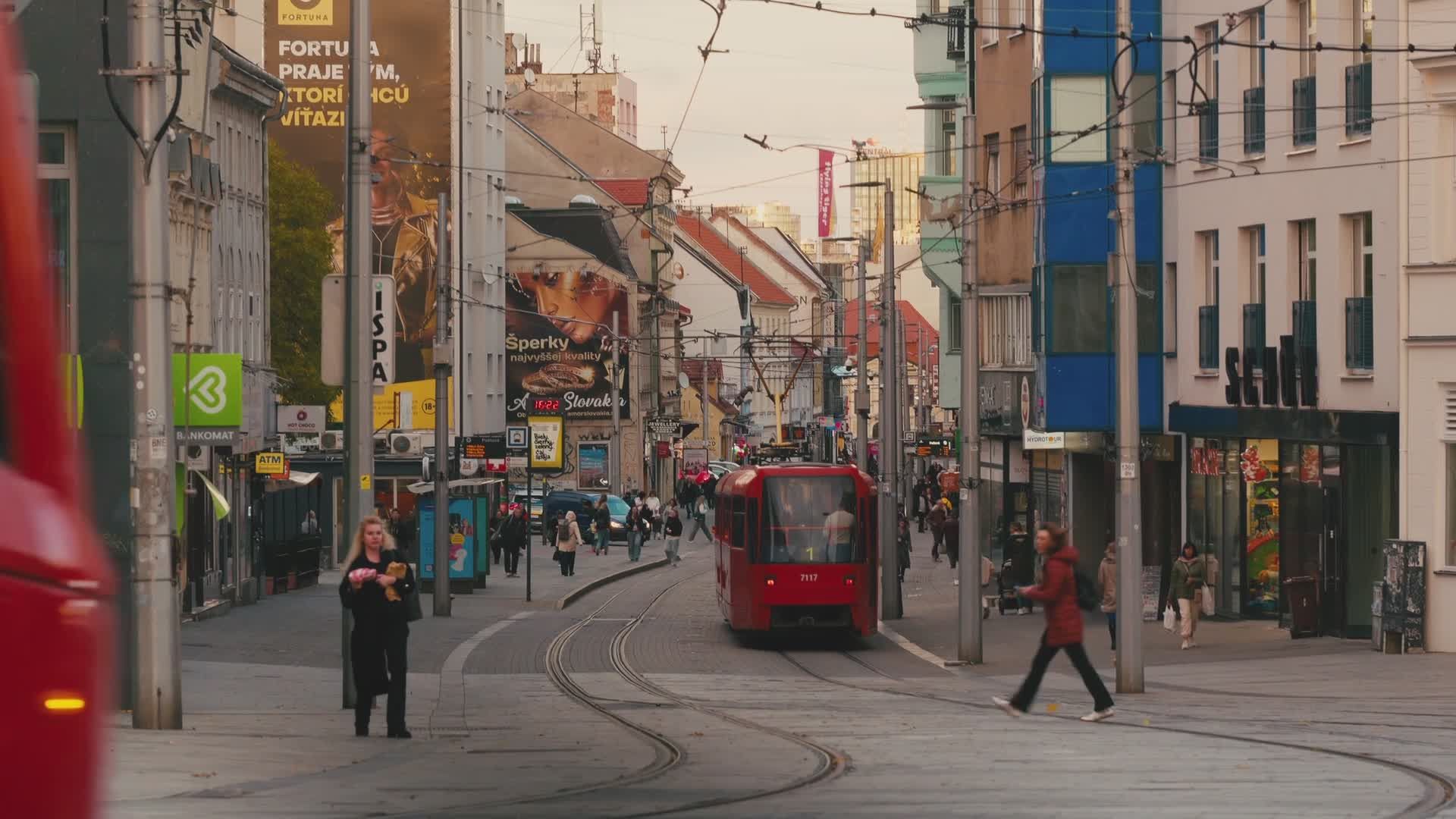 vibrant city street with red tram in motion 34597907 — free pexels stock footage