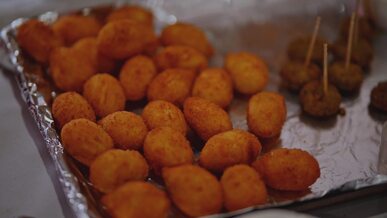 delicious fried finger foods on metal tray