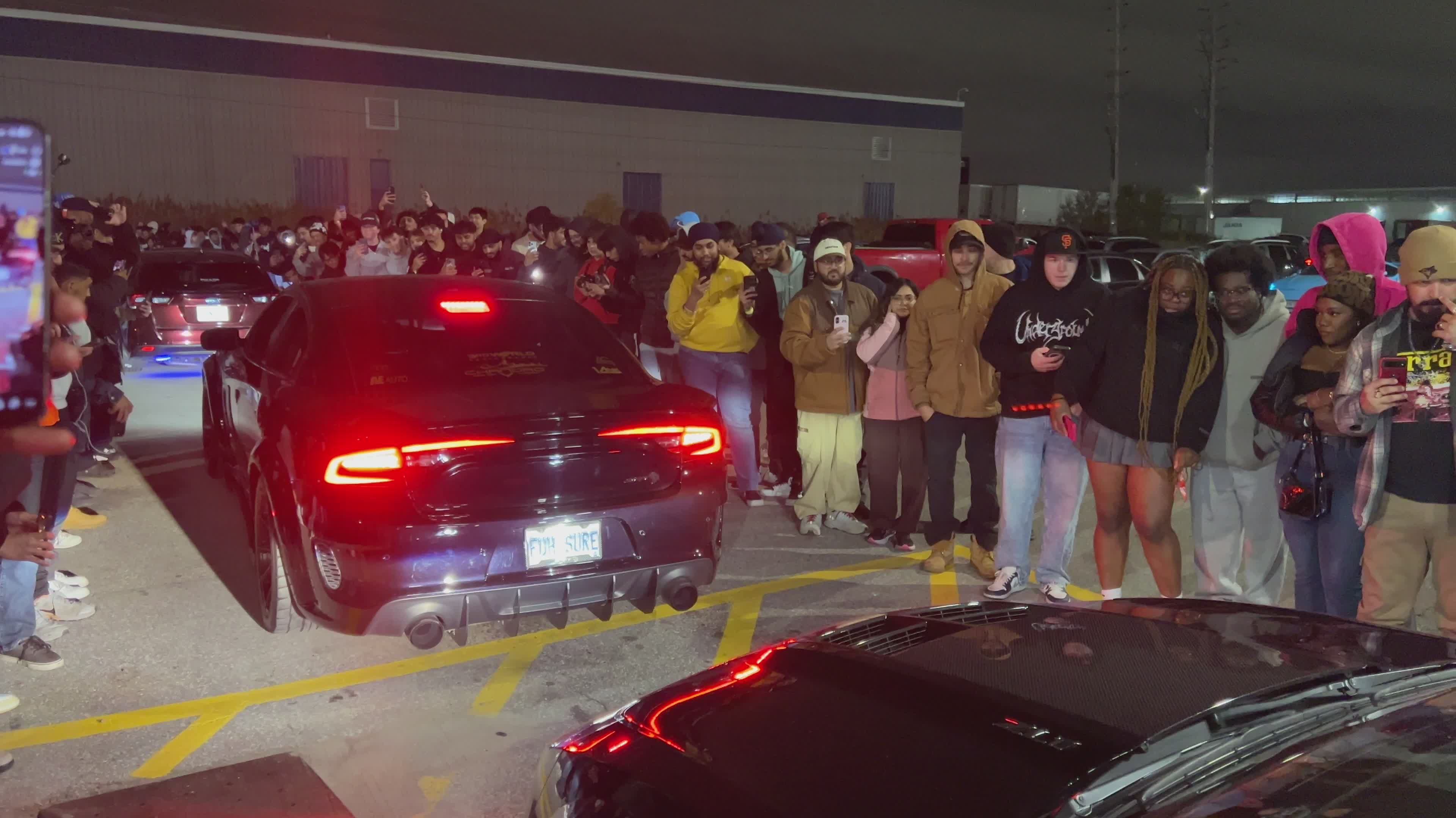 Nighttime Urban Car Show with Enthusiastic Crowd Free Stock Video ...