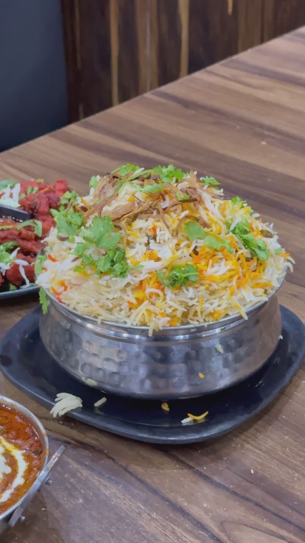 Delicious Indian Biryani with Papad and Raita Free Stock Video Footage ...