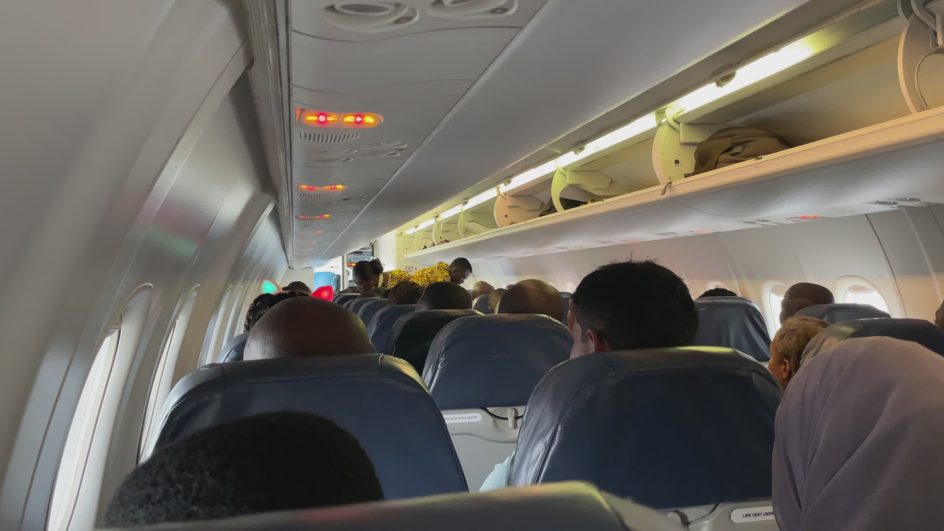 Passengers Seated in Airplane Cabin Interior View Free Stock Video ...
