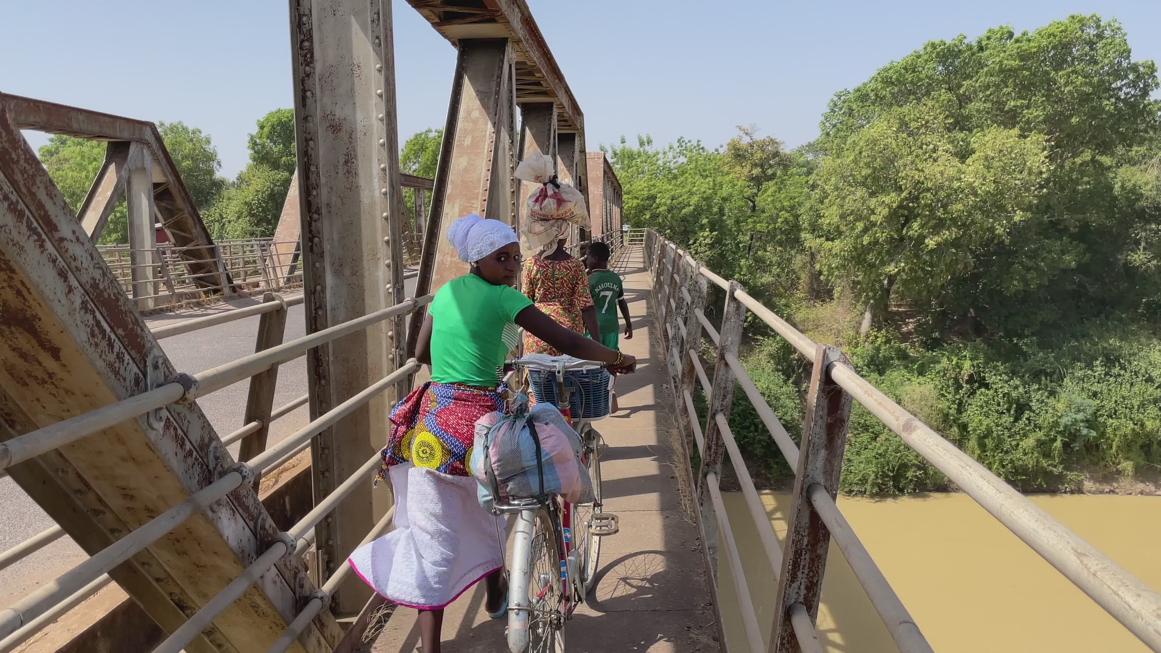 Rural Women Cycling Across a Bridge Free Stock Video Footage, Royalty ...
