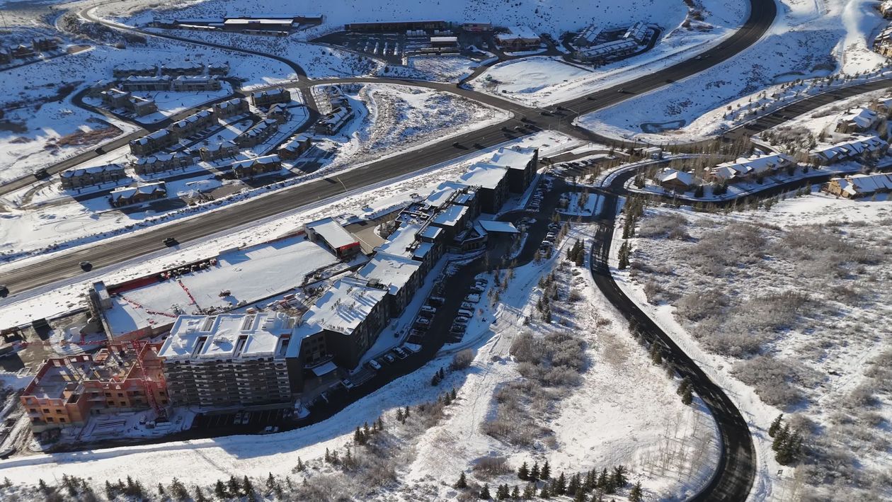 Aerial View of Snowy Mountain Resort in Winter Free Stock Video Footage ...