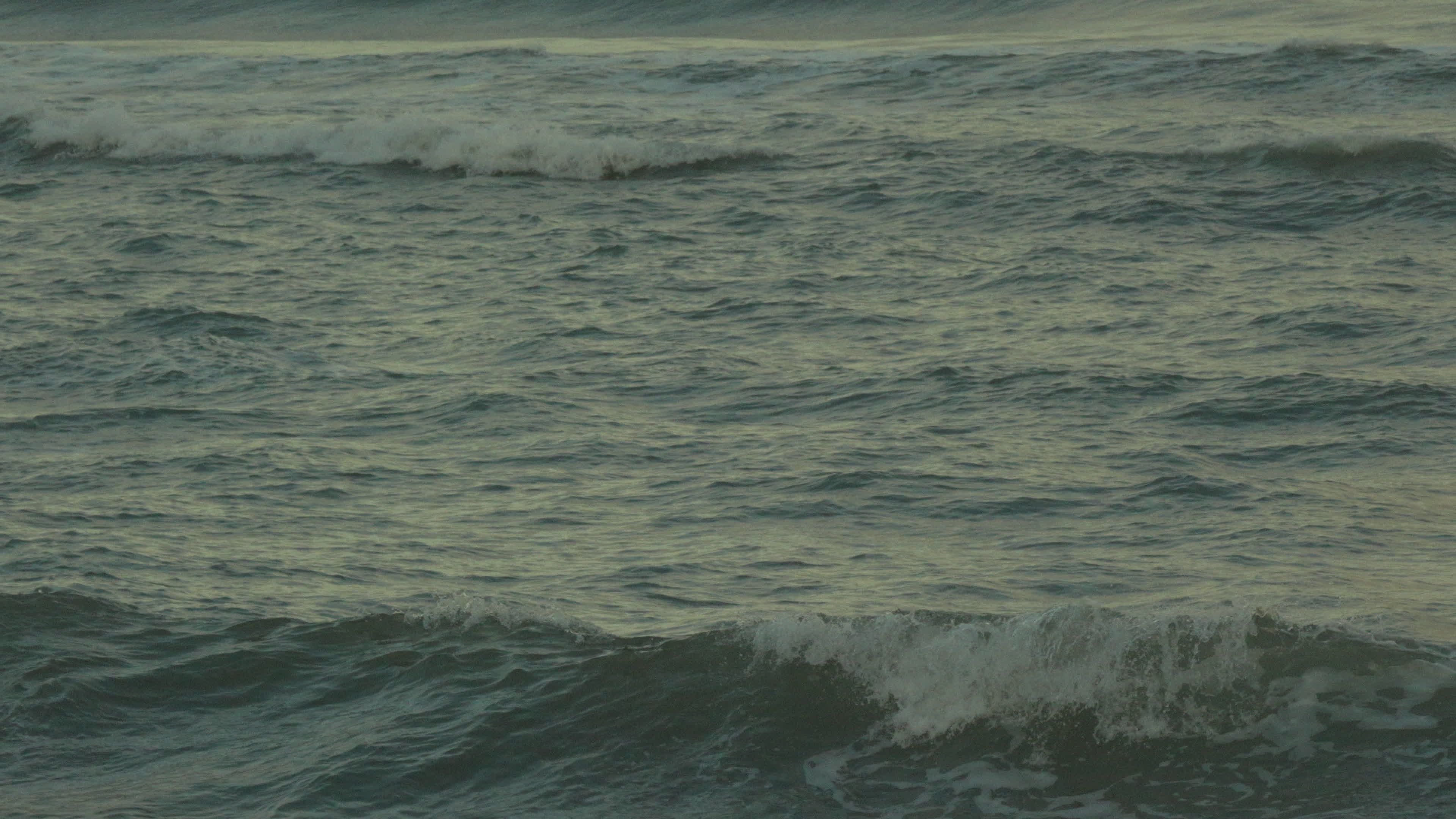 calm ocean waves at sunset 34754995