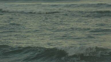 calm ocean waves at sunset