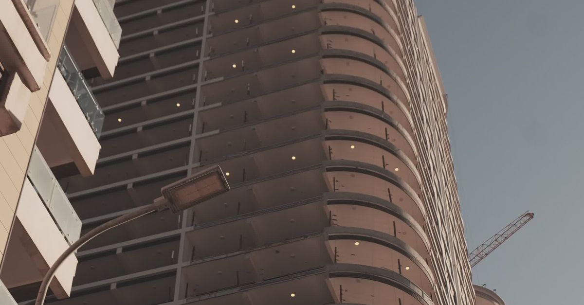 4k High Rides Building Modern High-Rise Building with Crane Construction Free Stock Video ...