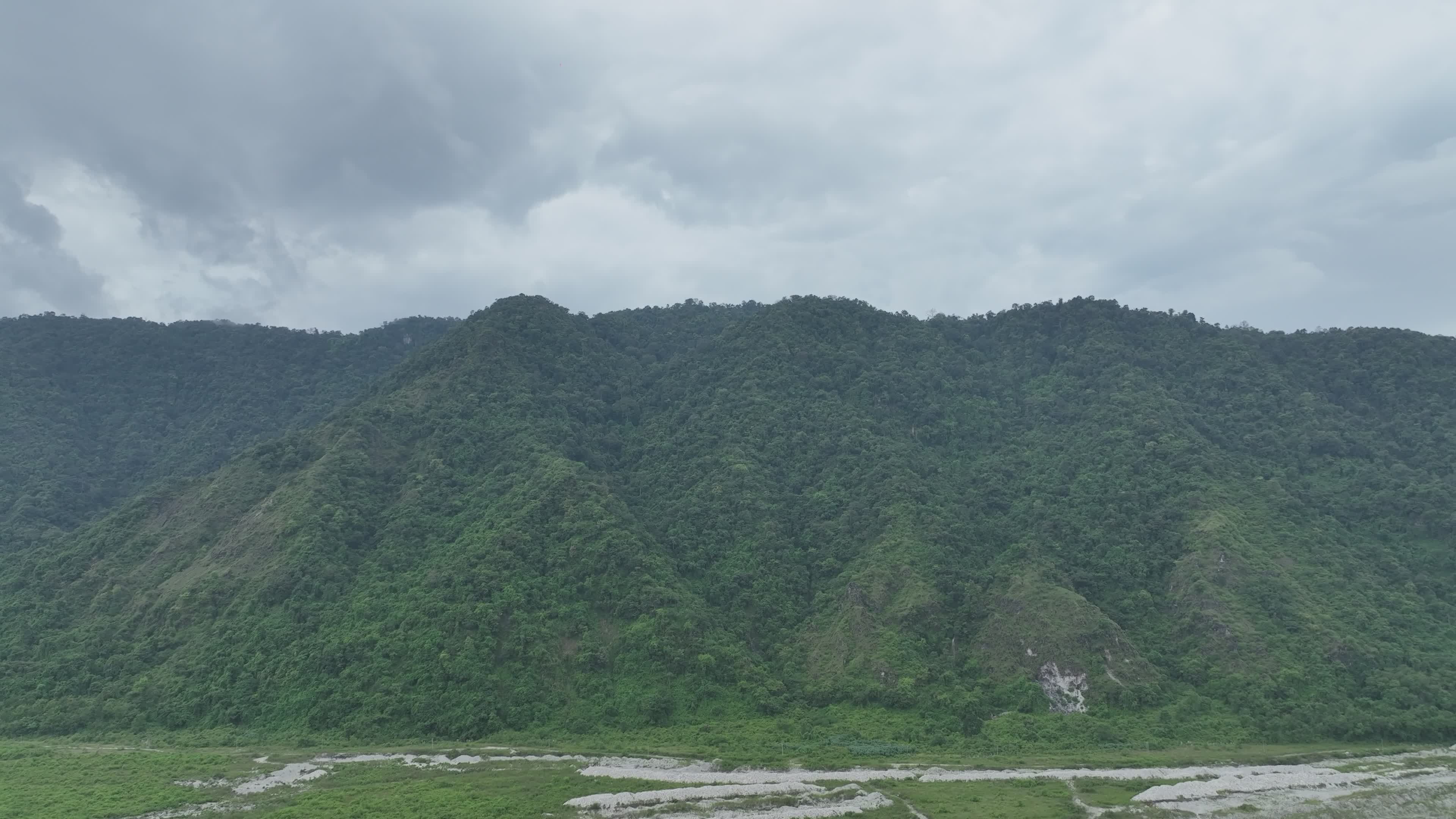 Lush Green Mountain Landscape Under Cloudy Sky Free Stock Video Footage ...