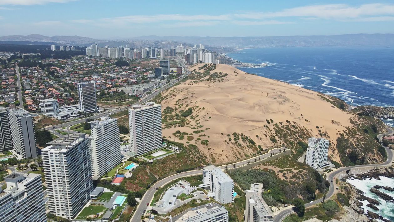 Aerial View of Coastal City with Sand Dunes Free Stock Video Footage ...