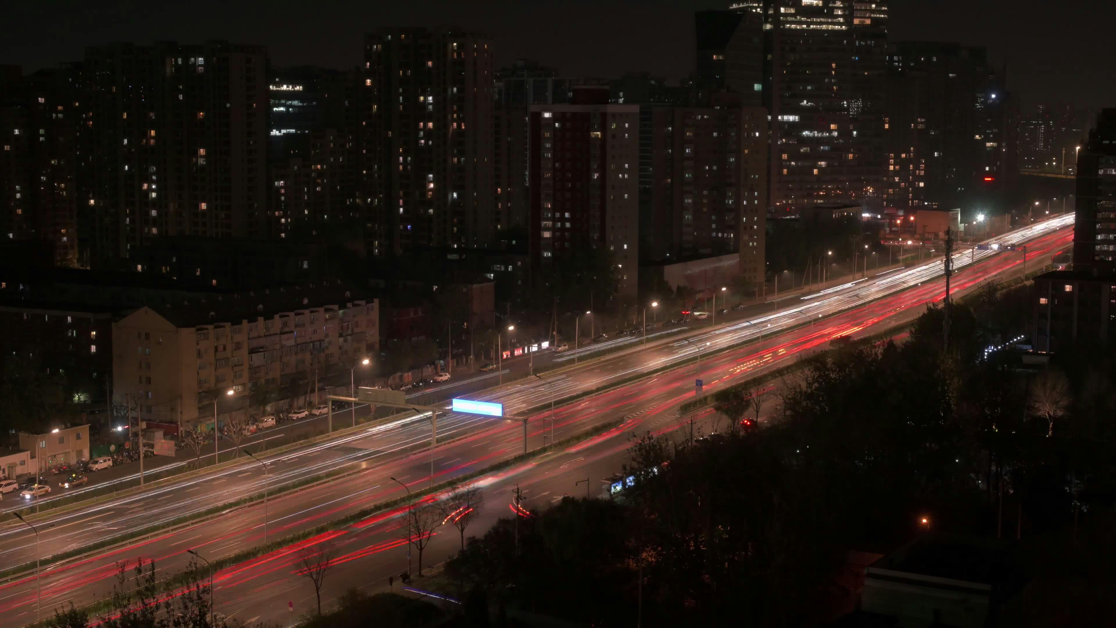 nighttime cityscape with light trails 34847802