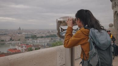 traveler viewing budapest skyline at fisherman s bastion