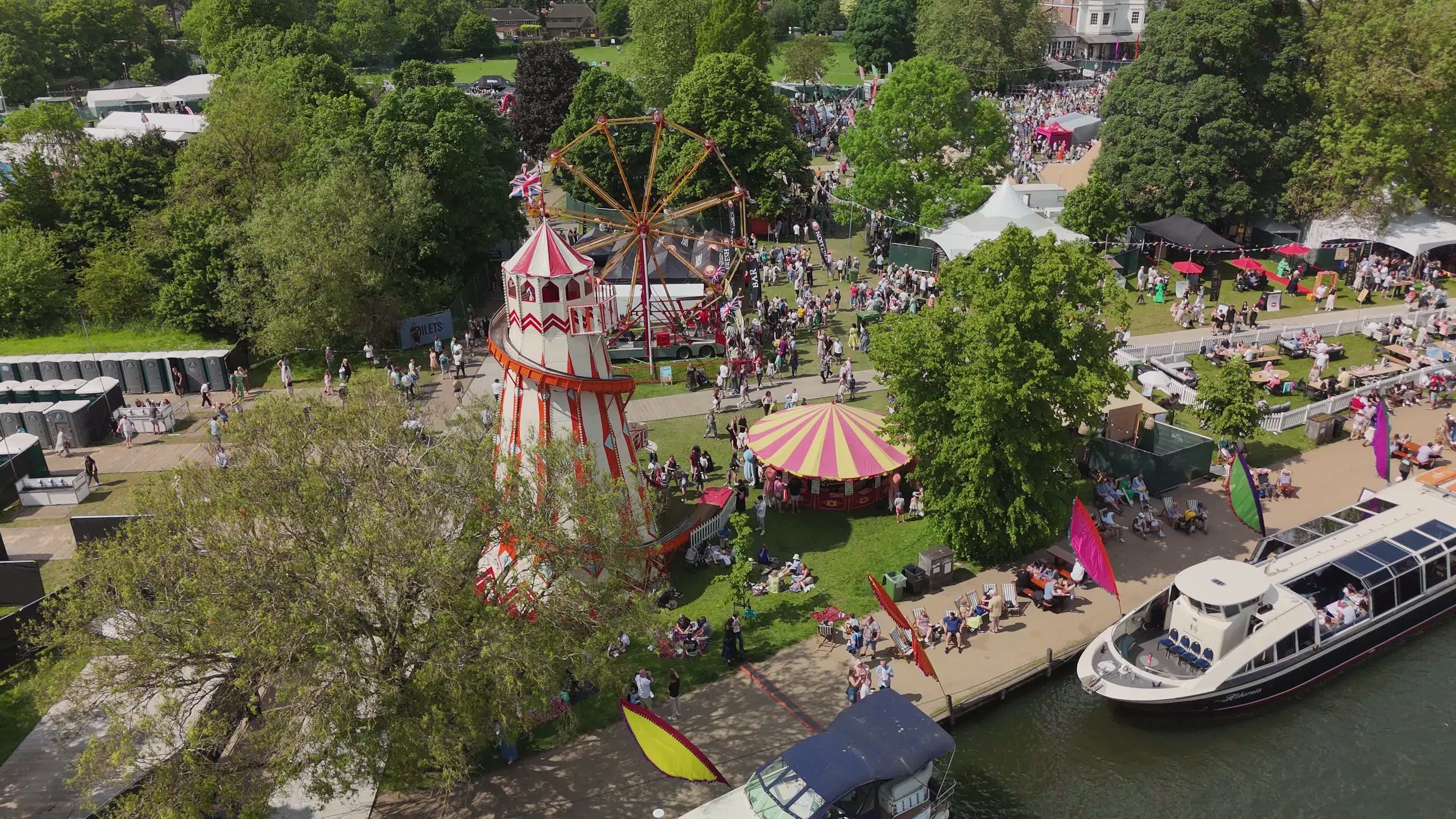 Lively Riverside Funfair with Boats and Carnival Free Stock Video ...