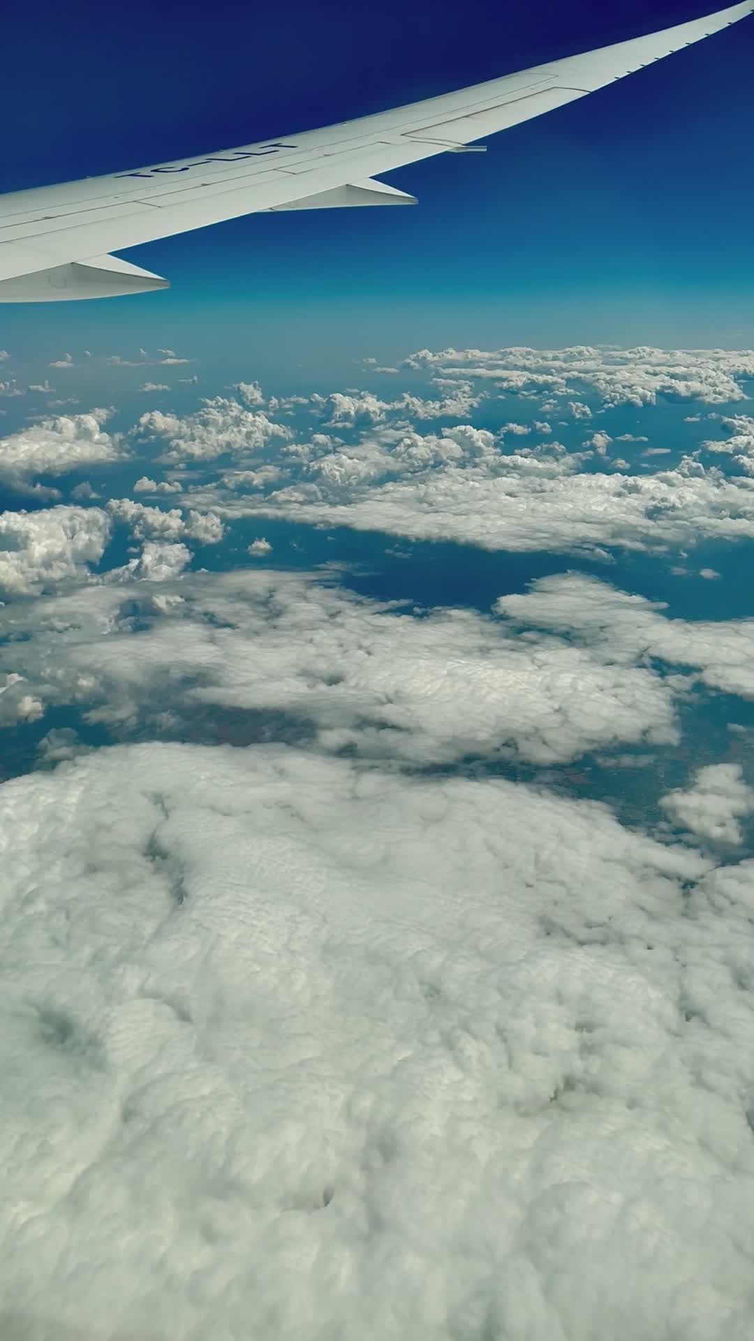 Scenic Aerial View from Airplane Over Clouds Free Stock Video Footage ...