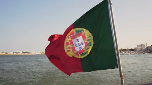 The Flag Of Portugal Raised On A Boat Flag Pole