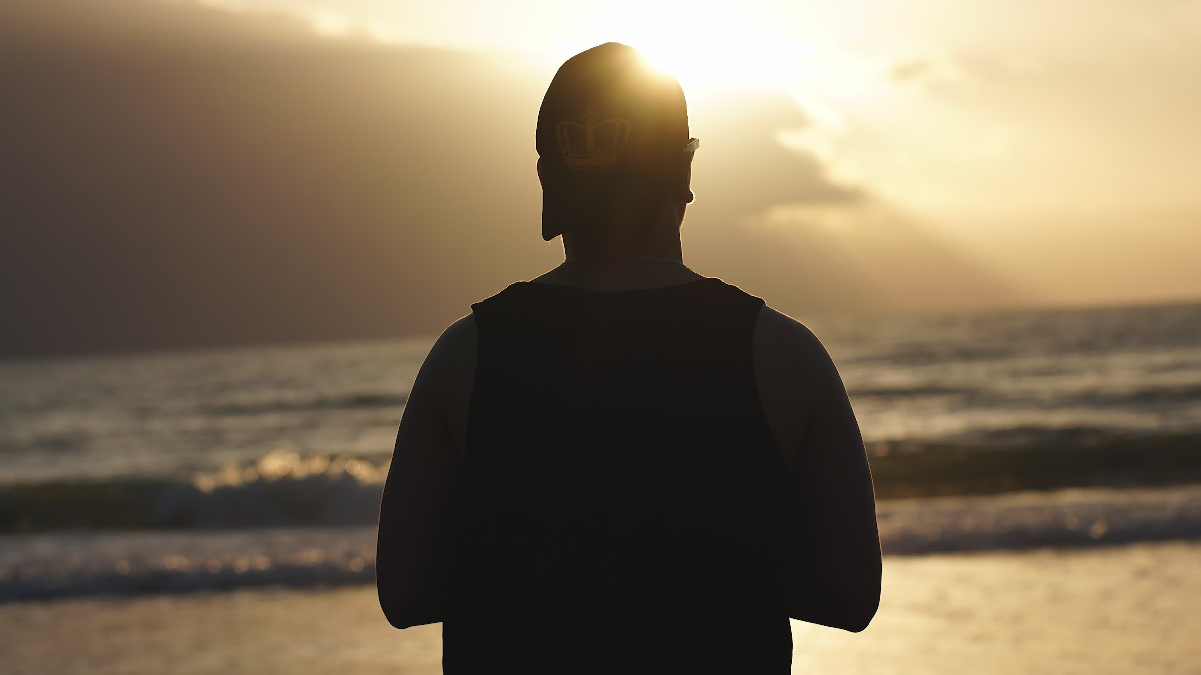Silhouette of Man Watching Sunset by the Sea Free Stock Video Footage ...